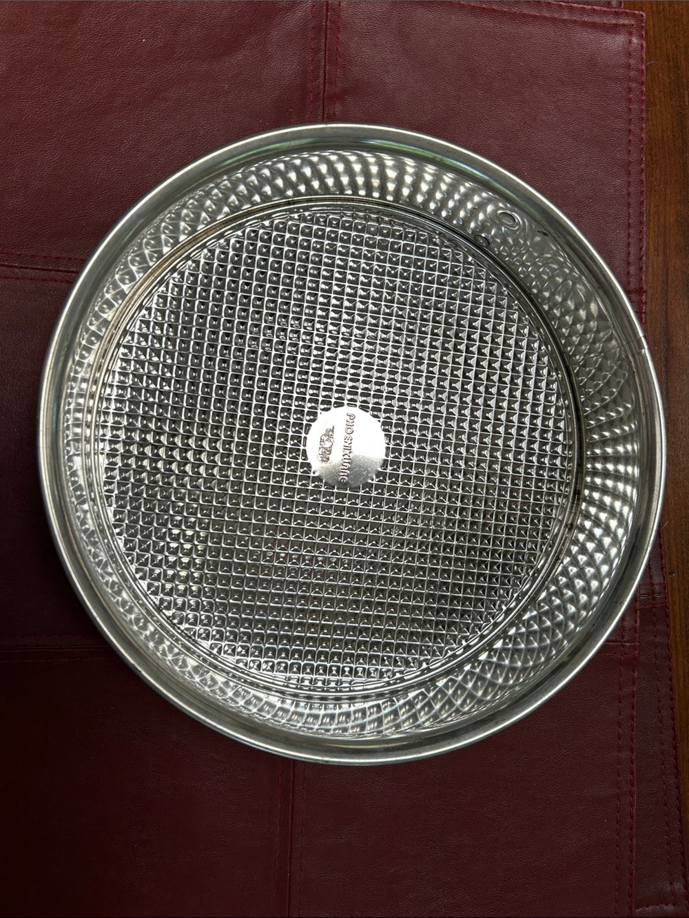Springform pan (cheesecakes?)Textured Metal Baking Pan - Silver, 9.5” diameter.